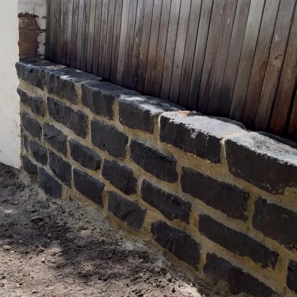 Rendered masonry boundary wall with gate